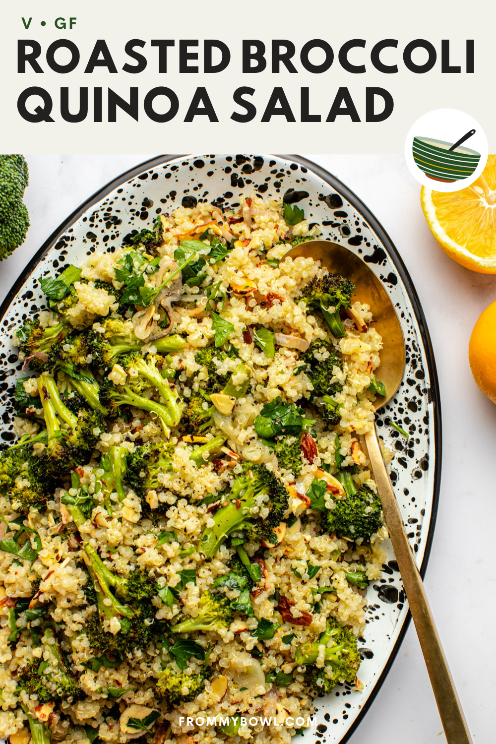 roasted broccoli quinoa salad served in an oval plate with a serving spoon digged in