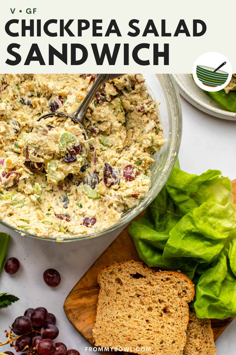 vegan chickpea salad and sandwich bread arranged on kitchen countertop