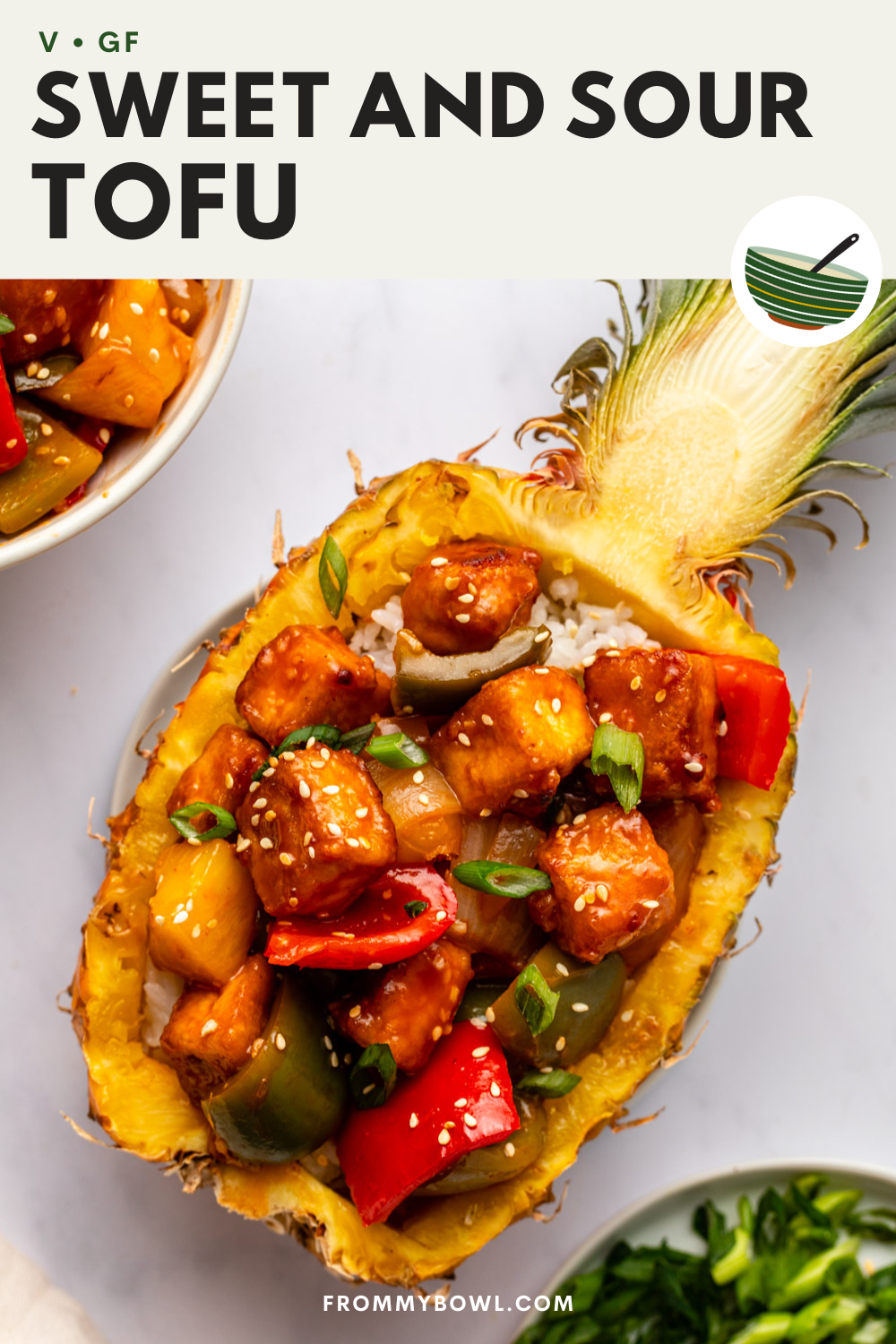 sweet and sour tofu served in a pineapple filled with rice