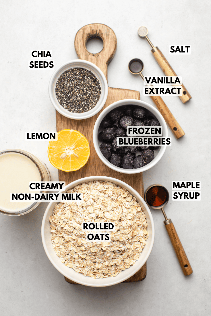 ingredients for blueberry overnight oats laid out on a kitchen countertop