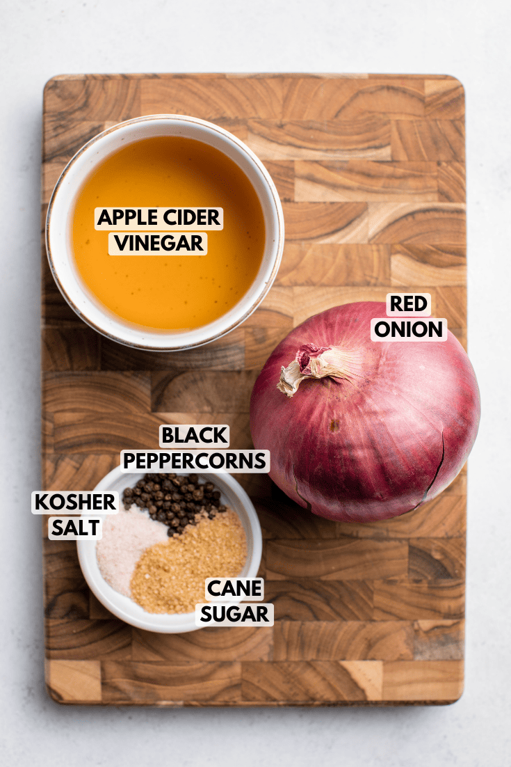 ingredients for pickled red onions laid out on a cutting board