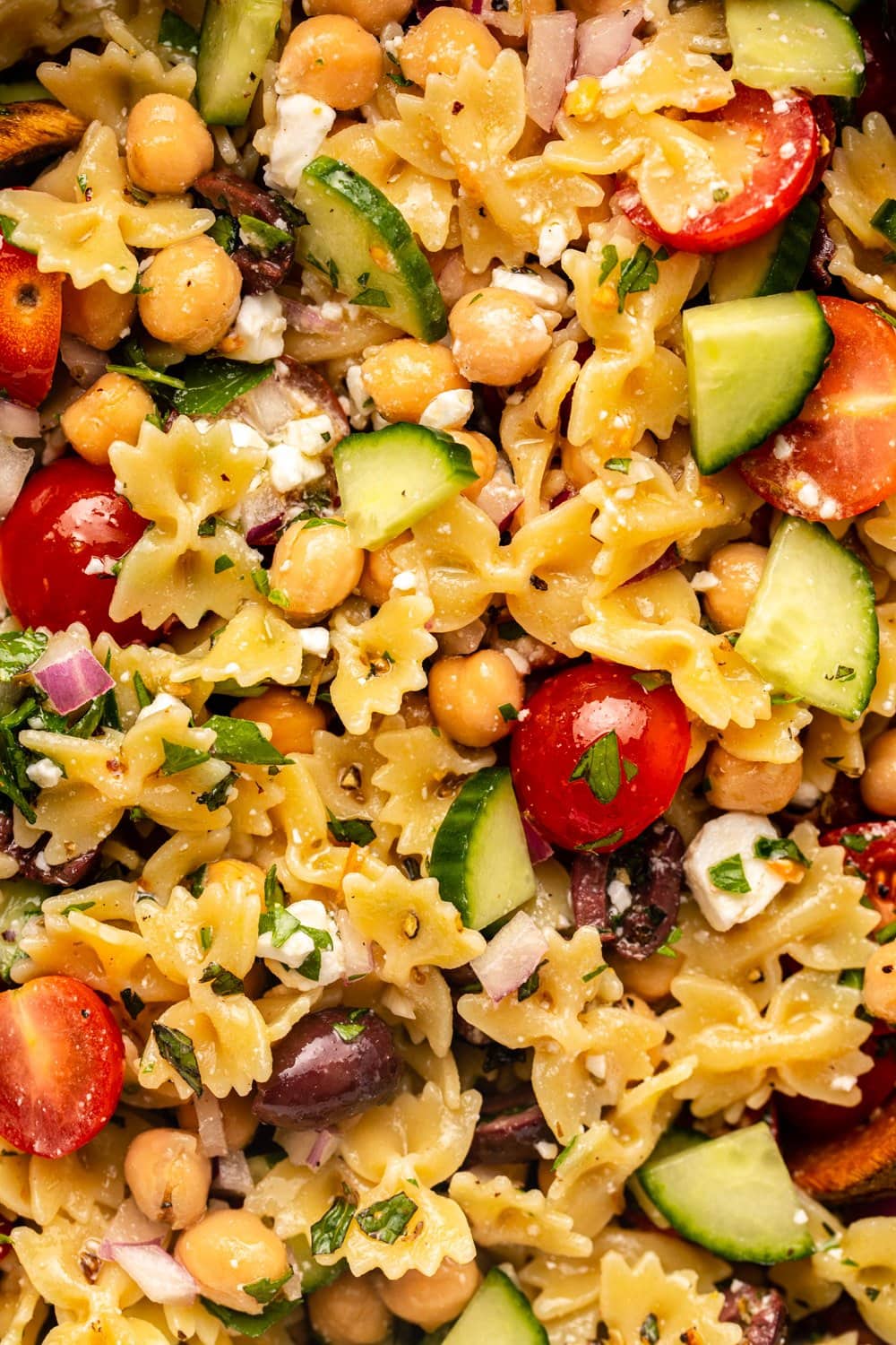 a zoomed in image of mediterranean pasta salad