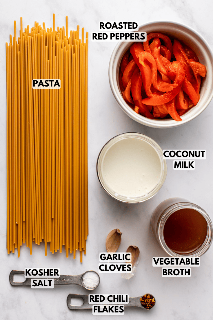 ingredients for roasted red pepper pasta laid out on a marble kitchen countertop