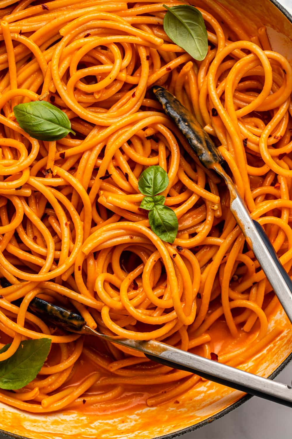 a zoomed in image of red pepper pasta