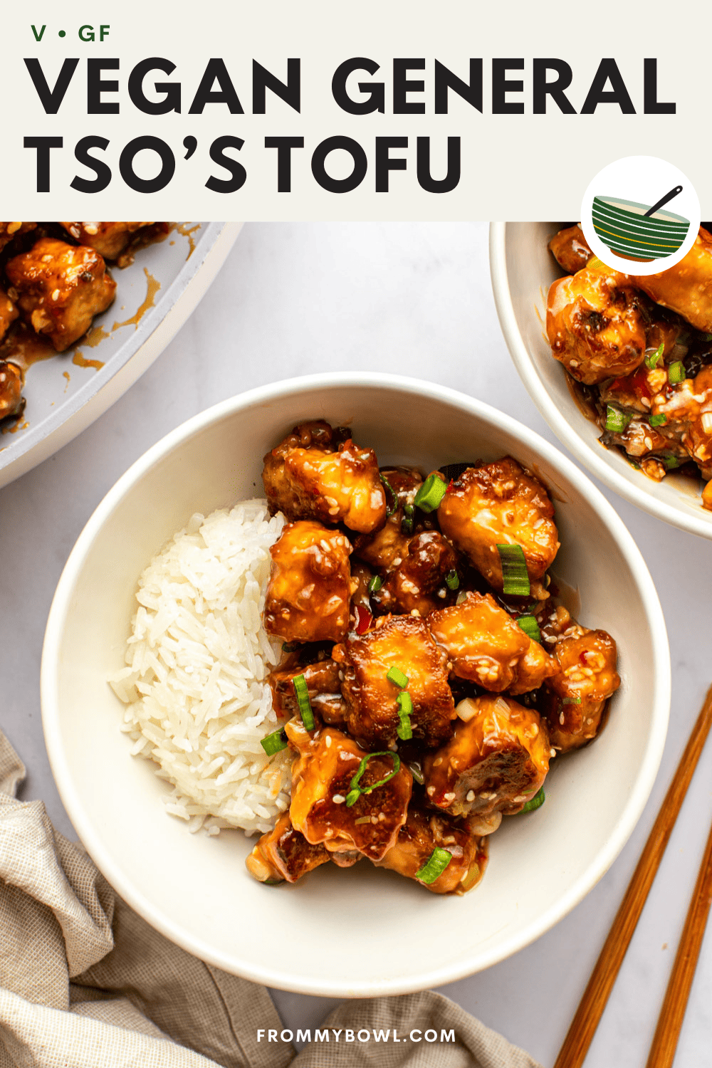 general tso's tofu served over rice in a small white bowl