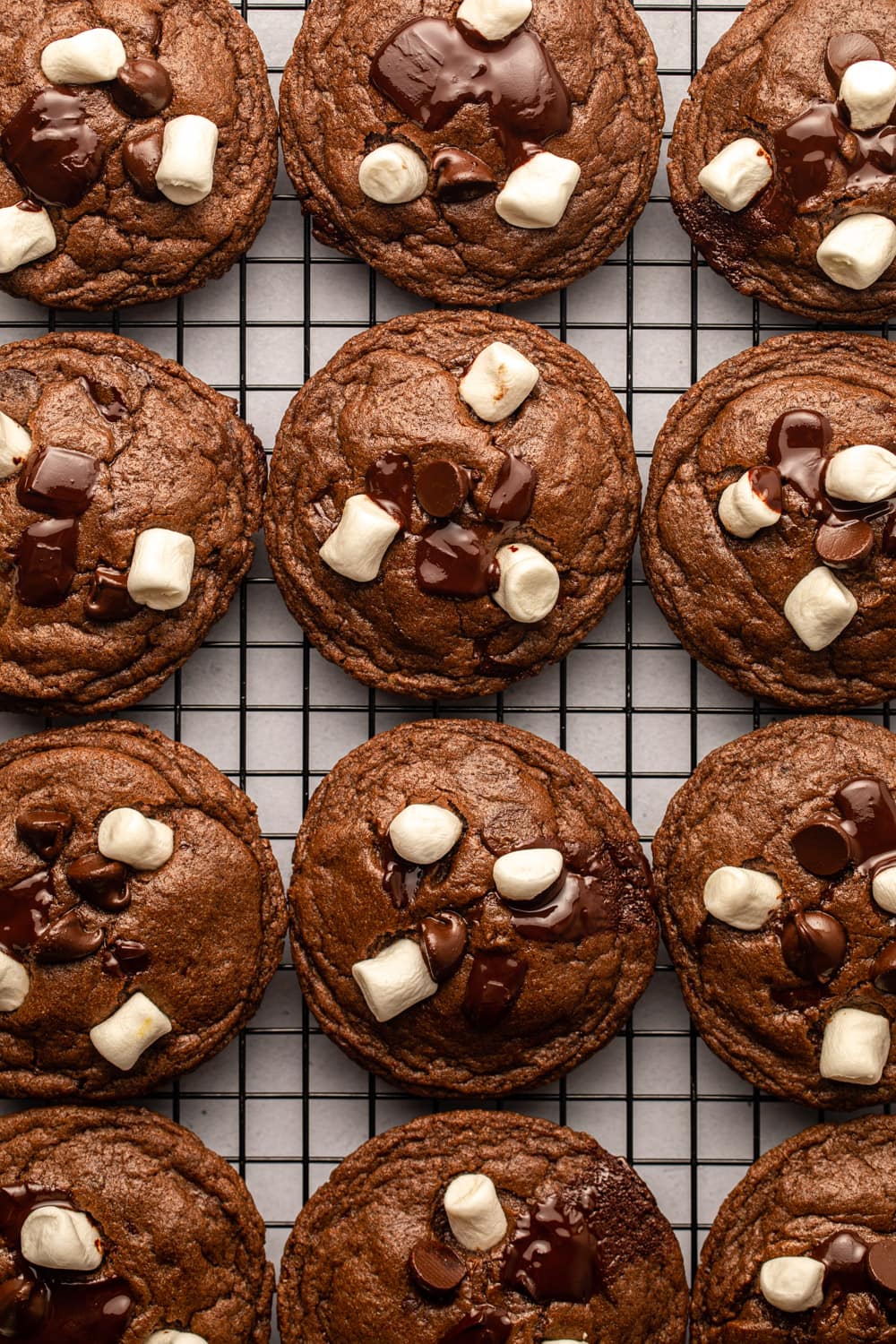 hot cocoa cookies resting on a cooling rack