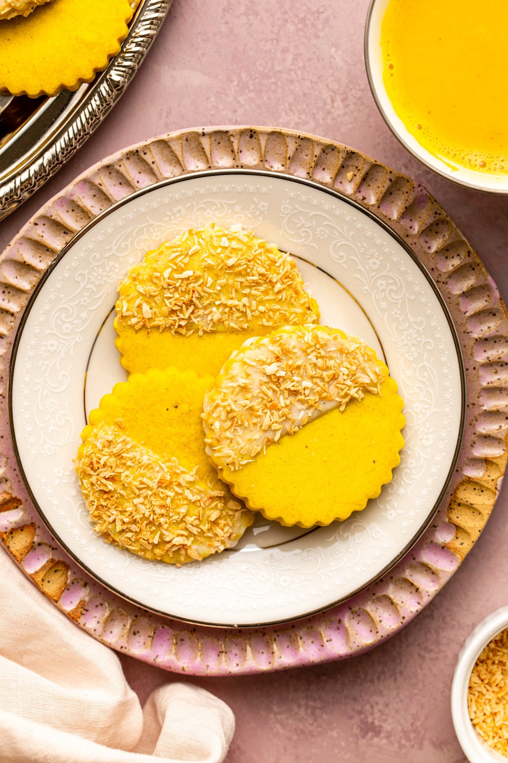 three golden milk shortbread cookies served on a white plate