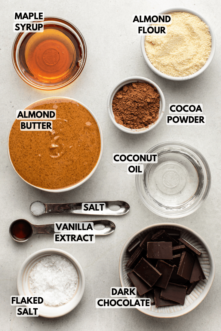 ingredients for almond butter bars laid out on a marble kitchen countertop