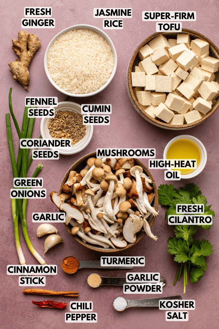 ingredients for turmeric ginger congee laid out on a marble kitchen countertop
