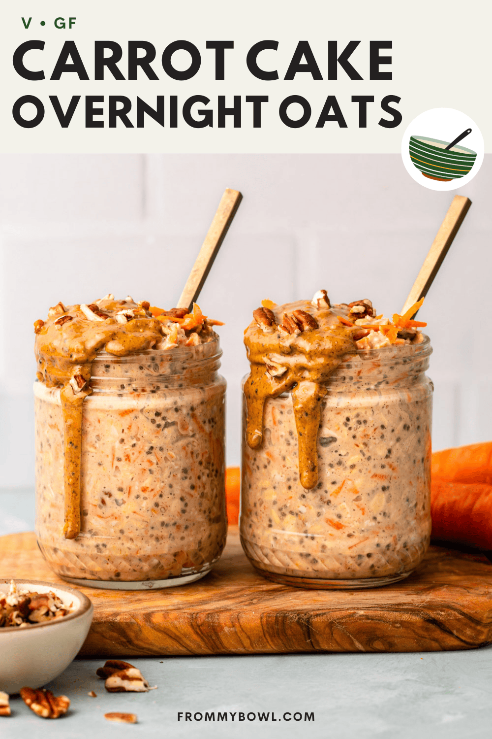 two jars of carrot cake overnight oats placed on a cutting board with a small bowl of shopped pecans set aside
