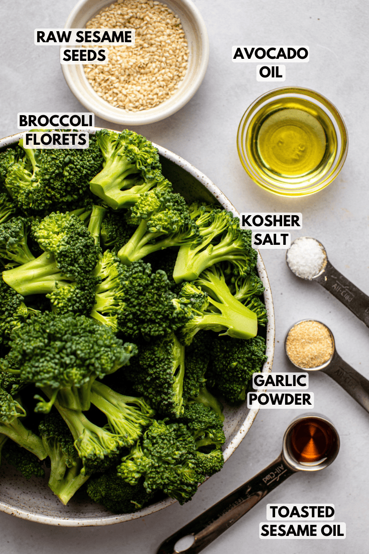 ingredients for roasted garlic sesame broccoli laid out on a marble kitchen countertop