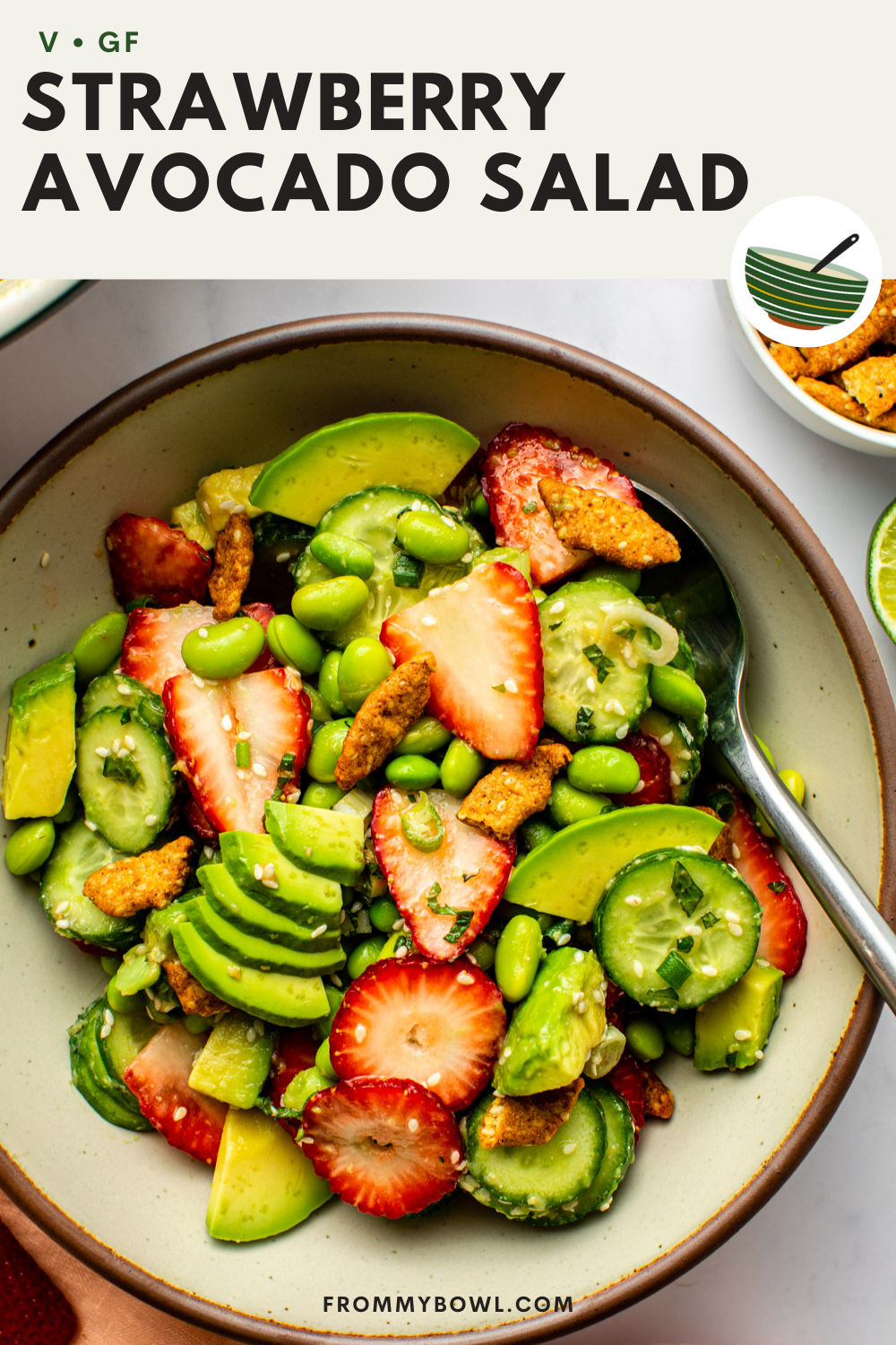 strawberry avocado crunch salad served on a wide bowl topped with fresh mint and green onions