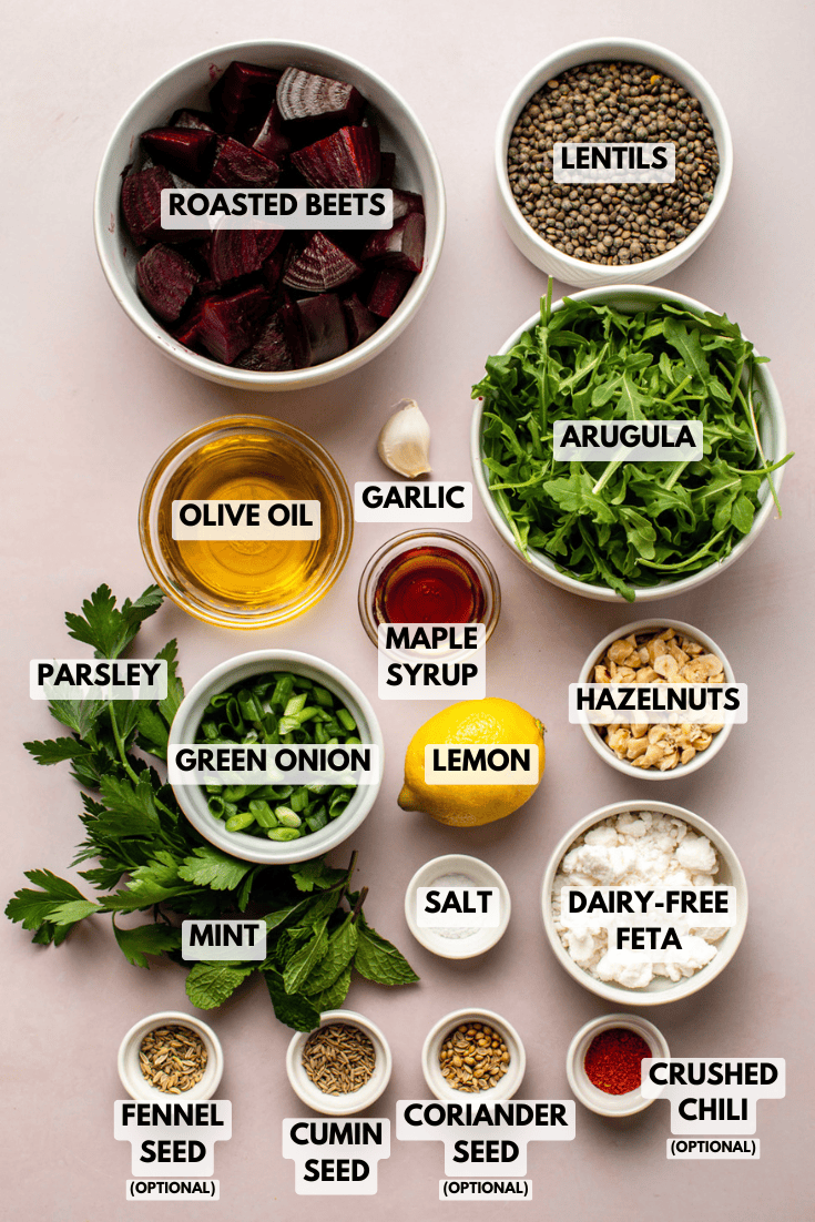 top-down view of all salad ingredients neatly arranged in small bowls on a kitchen countertop in a mise-en-place setup