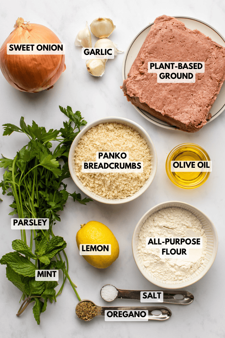 ingredients for vegan greek meatballs are arranged mise-en-place on a kitchen countertop, with all components measured and prepared in separate bowls before cooking.